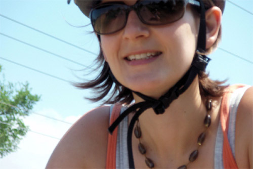 woman wearning glasses and bicycle helmet