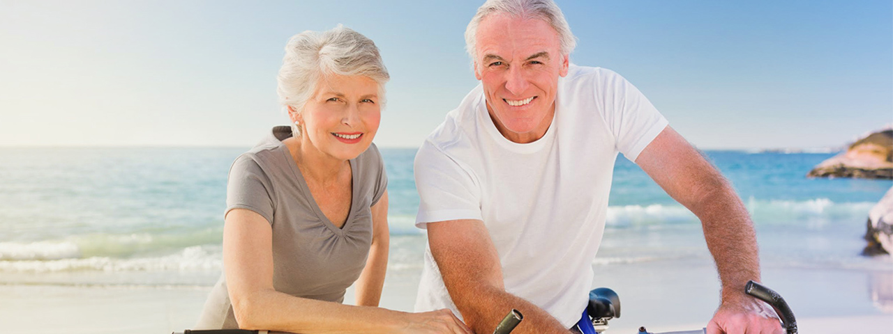 Elderly Man and Woman on Beach, with Macular Degeneration in Jersey City
